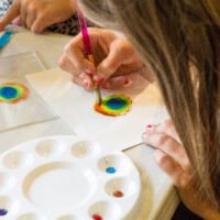 Kids doing press painting, Yellowstone National Park 